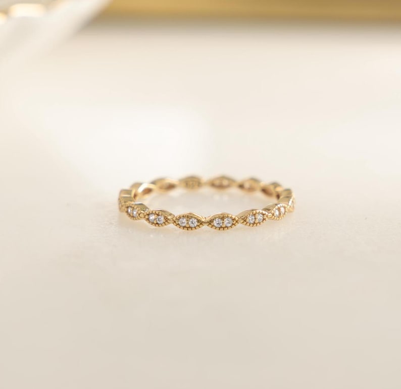 Closeup image of dainty stacking ring in gold