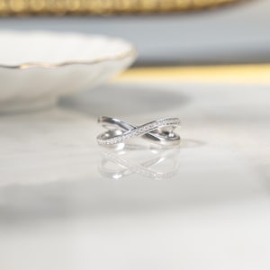 Close-up of a silver cross ring