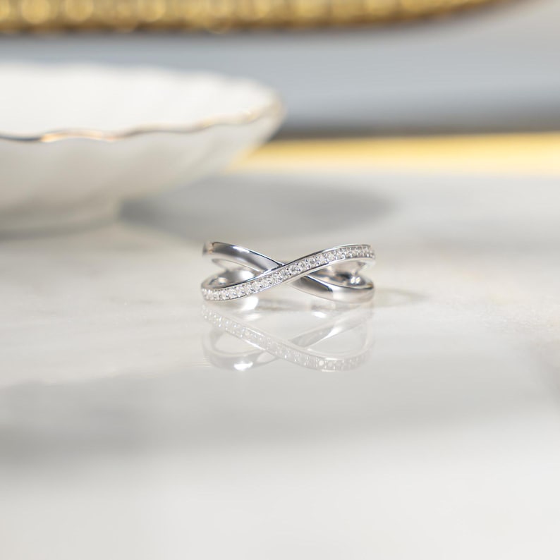 Close-up of a silver cross ring