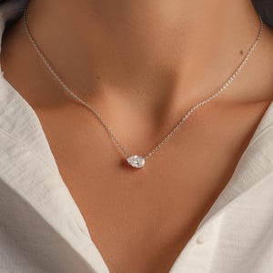 Model wearing sterling silver dainty diamond necklace