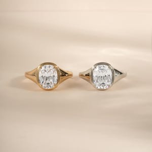 Elongated cushion cut ring shown in both gold and sterling silver for a versatile wedding ring option.