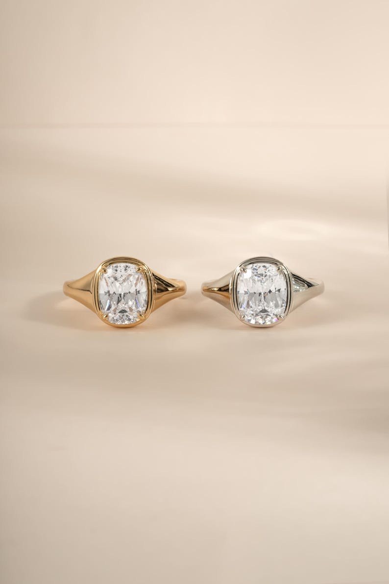 Elongated cushion cut ring shown in both gold and sterling silver for a versatile wedding ring option.