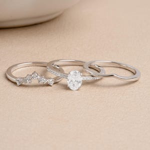Sterling silver unique ring set on a beige background
