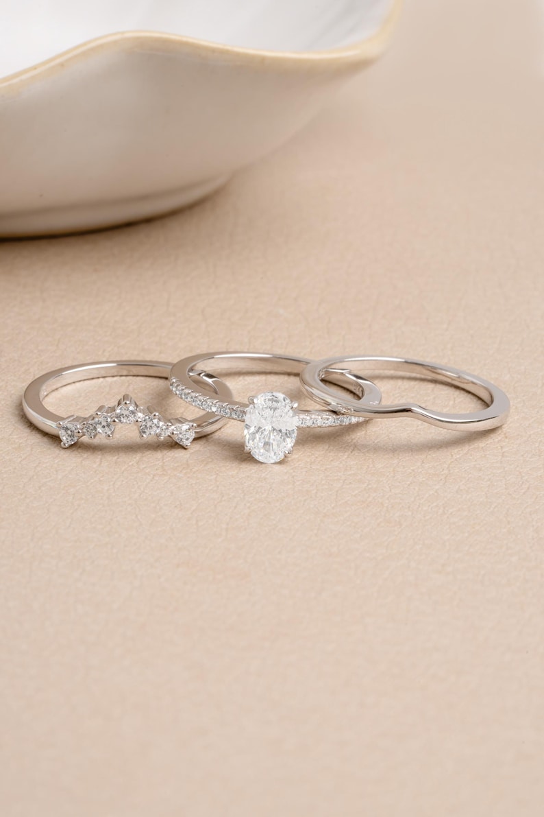 Sterling silver unique ring set on a beige background