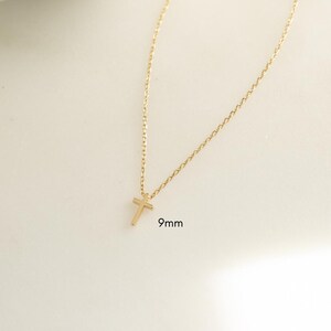 Dainty 9mm gold cross necklace