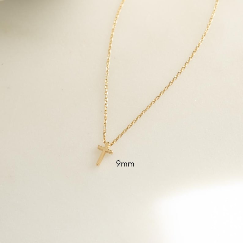 Dainty 9mm gold cross necklace