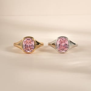 Elongated pink gemstone ring shown in both gold and sterling silver finishes