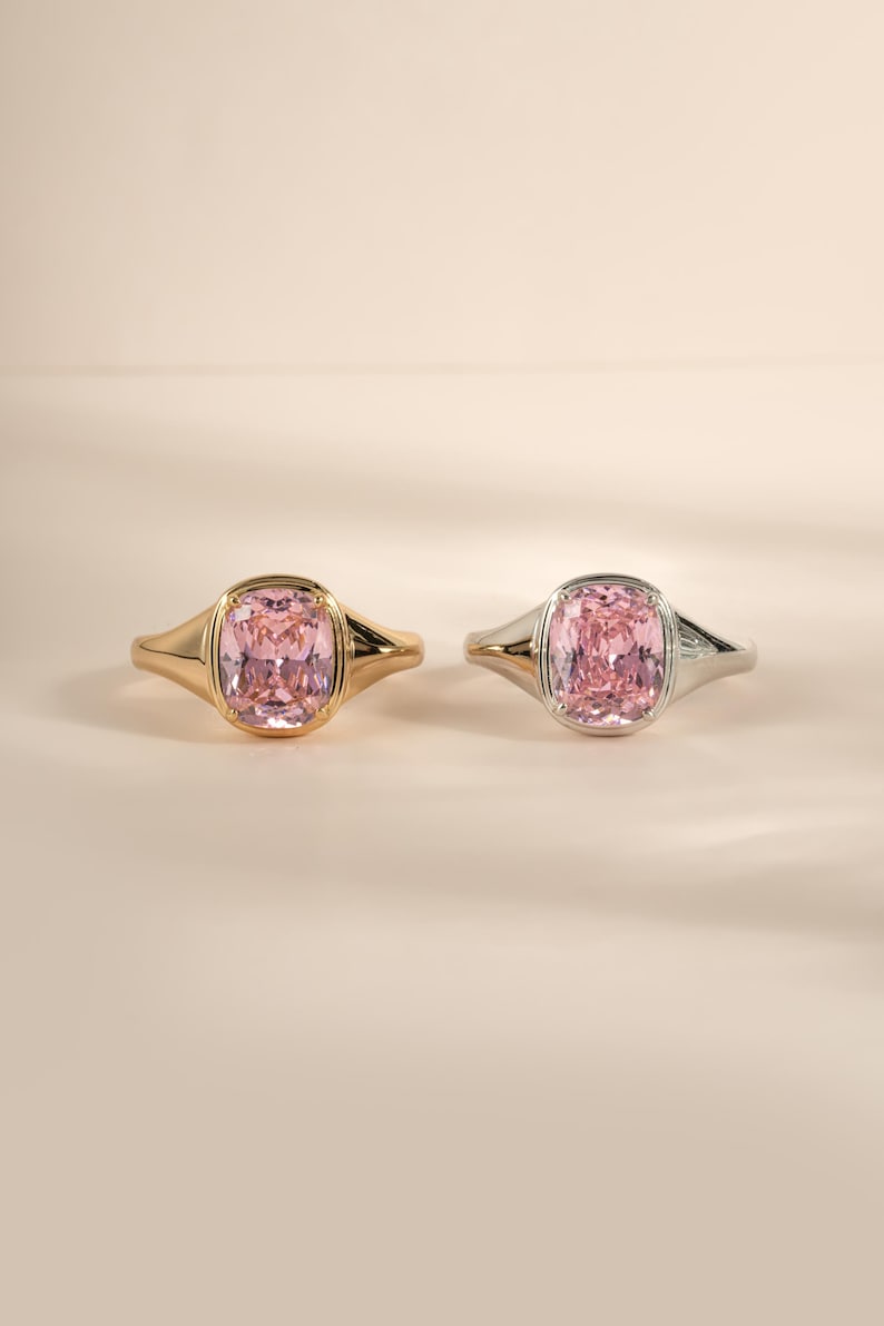 Elongated pink gemstone ring shown in both gold and sterling silver finishes