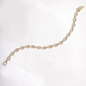 gold chain bracelet with cubic zirconia stones on the links