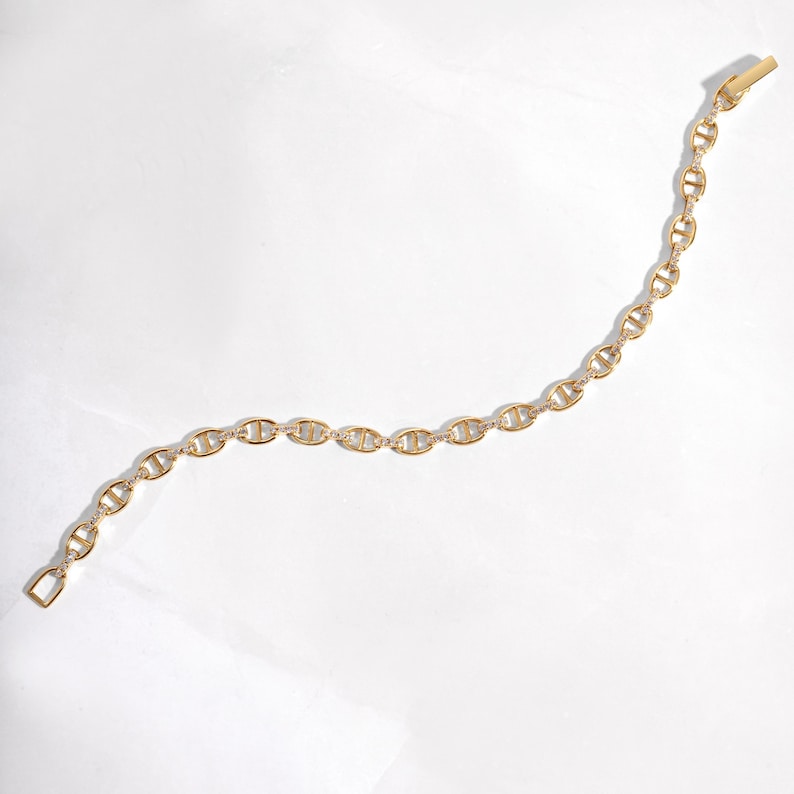 gold chain bracelet with cubic zirconia stones on the links