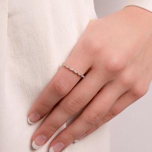 Model wearing simple silver stacking band