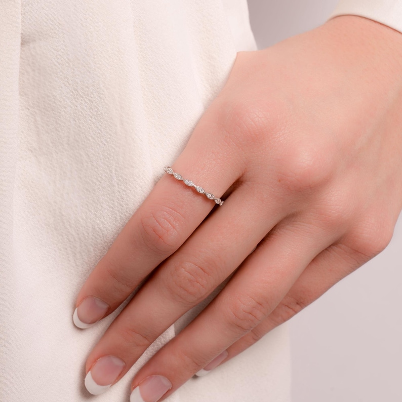 Model wearing simple silver stacking band