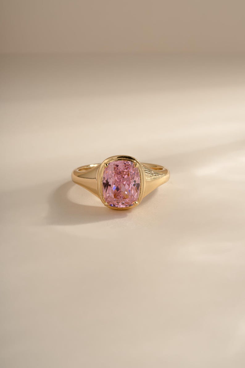 Elongated pink solitaire cz ring in gold front view