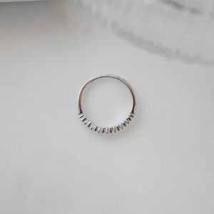 birds eye view of sterling silver fluted ring with diamonds