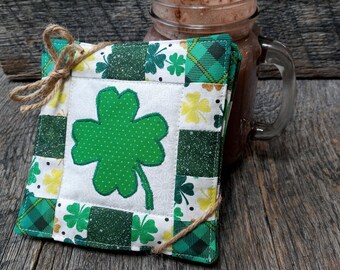 Hand made coasters with country Christmas charm sold in sets of 4. Quilted Christmas coasters with appliqued Christmas tree and star