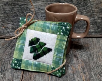 Hand made coasters with country Christmas charm sold in sets of 4. Quilted Christmas coasters with appliqued Christmas tree and star