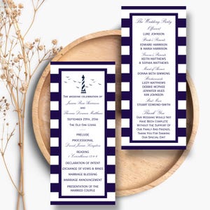 May include: Two rectangular wedding program cards featuring a navy blue and white horizontal striped border. The cards display printed text detailing the wedding ceremony order, the wedding party, and a thank you message, with a lighthouse graphic.