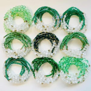Customizable Friendship Bracelet Stack: Teal and Green Glass Beads, Elastic, Charms | Debut Album Inspired