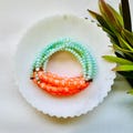 Friendship Bracelet: Teal, Orange, Mint Green, Charms, Elastic | Customizable | Showgirl Inspired product logo