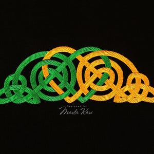 May include: Green and orange Celtic knot design embroidery. The design is in the shape of a heart with a knot pattern. The text "Designed by Marta Kari" is at the bottom of the design.