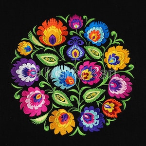 May include: A circular floral embroidery design featuring a variety of colorful flowers in shades of orange, yellow, pink, blue, and purple. The flowers are arranged around a central point with green leaves and stems on a black background.