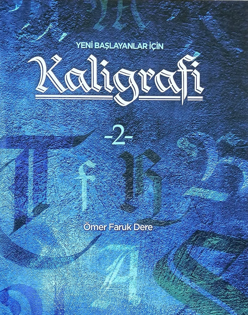 May include: A blue book cover with the title "Kaligrafi -2- Yeni Başlayanlar İ&ccedil;in" and the author's name "&Ouml;mer Faruk Dere" in white text.