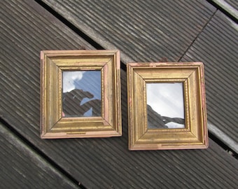 Set of two small rectangular frames in gilded wood. 1950s