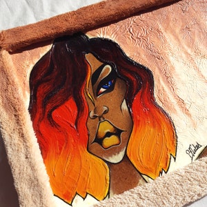 May include: A painting of a woman with long, orange and red hair. Her eyes are blue and her lips are yellow. The background is a light brown colour.