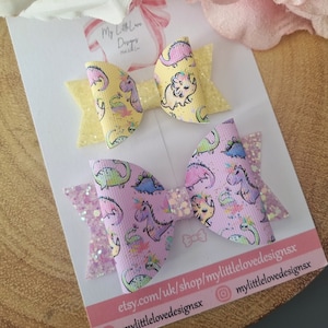 dinosaur print hair bow **SOLD INDIVIDUALLY**