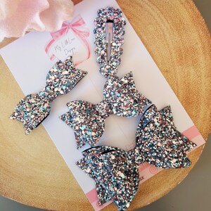 Pink ice glitter bow **SOLD INDIVIDUALLY**