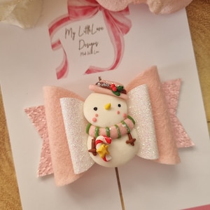 Noeud de bonhomme de neige givré rose délicat