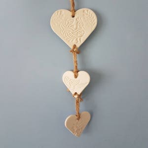 White clay hanging trio of hearts with peacock henna style design on natural twine. Wall hanging. Heart wall. Gift. Valentine's. Decoration. image 3