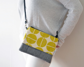 Padded Pouch made with Japanese fabrics. Strap made of real leather that adapts to be used as crossbody clutch, handbag or wristlet pouch