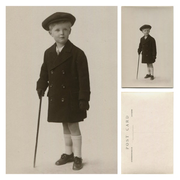 Small boy with flat cap and cane, antique or vintage photograph, child portrait, old photo, gloves, socks and shoes, RPPC