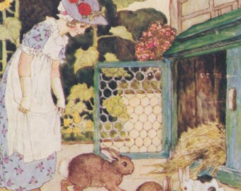 Vintage postcard: Feeding Bunnies, rabbits outside hutch, artist Millicent Sowerby, Medici c 1980s, 105 x 150 mm