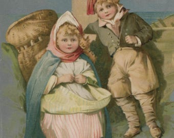 Antique Christmas postcard: children dressed as fisherfolk, silver tone background, publisher Stewart & Woolf, postmarked 1904, 90 x 140 mm