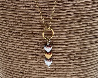 shell bead necklace with black and gold sahri thread Intertwined hematite