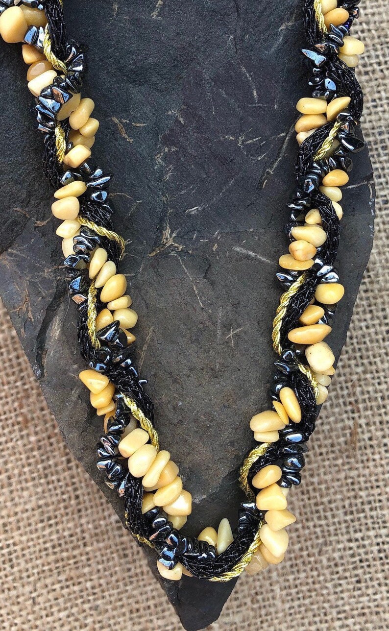 shell bead necklace with black and gold sahri thread Intertwined hematite