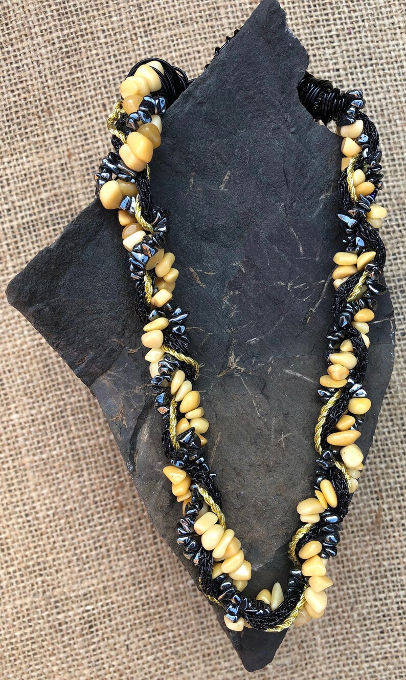 shell bead necklace with black and gold sahri thread Intertwined hematite