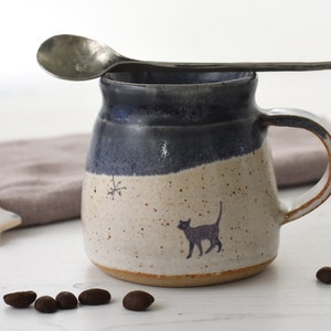 Dinky ceramic espresso cup with original cat illustration - glazed in midnight blue and creamy white - handmade pottery