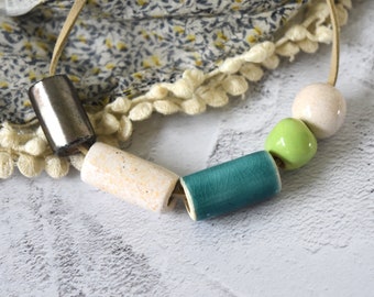 Ceramic Bead Necklace - hand-formed emerald and mint green, silver and ivory glazed beads on a  faux suede band