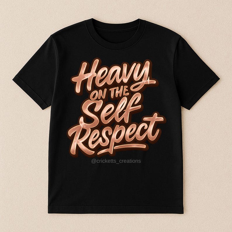 Puede incluir: Camiseta negra con la frase "Heavy on the Self Respect" en color cobre, en fuente cursiva con efecto 3D. La cuenta de redes sociales @cricketts_creations est&aacute; en la parte inferior.
