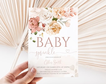 May include: A rectangular invitation card featuring a floral arrangement of dusty rose, cream, and peach flowers at the top. The text reads BABY sprinkle, JOIN US IN HONOR OF Esther Smith, SATURDAY | DECEMBER 12TH | AT 2:00PM, TWELVE COUNTRY CLUB, 1200 FOREST RD. LOS ANGELES, CA 07854, RSVP TO JENN AT 7771234567 BY DECEMBER 5TH.