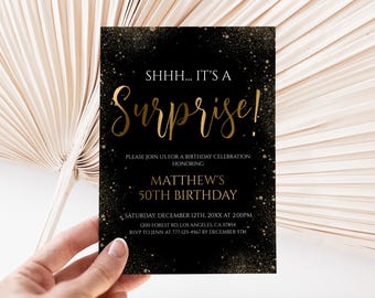 May include: A rectangular birthday invitation card with a black background and gold glitter accents. The text reads: SHHH... IT'S A Surprise! PLEASE JOIN US FOR A BIRTHDAY CELEBRATION HONORING MATTHEW'S 50TH BIRTHDAY SATURDAY, DECEMBER 12TH, 20XX AT 2:00PM.