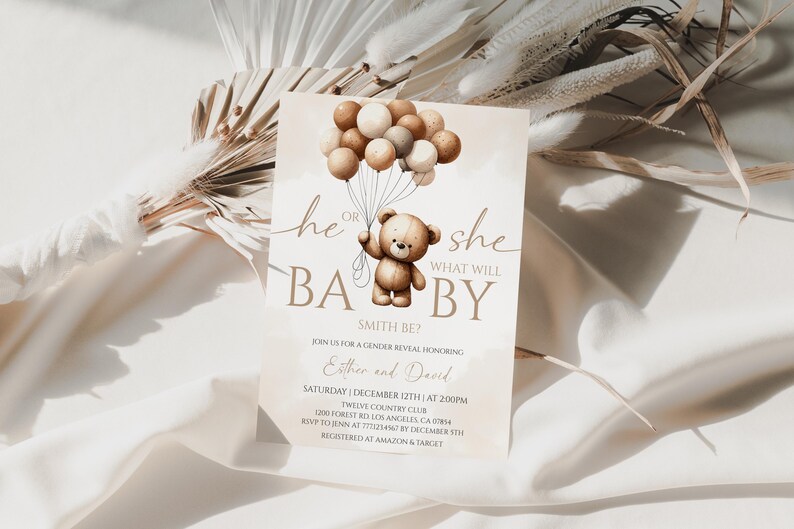 May include: A gender reveal invitation card with a teddy bear holding balloons. The text reads "He or She, What Will Baby Be?" in brown script. The invitation includes event details and is set against a neutral background.