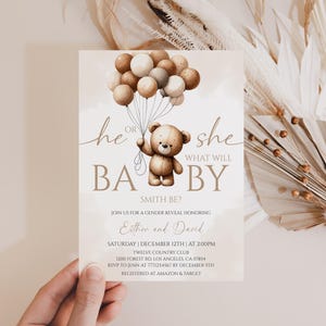 May include: A gender reveal invitation card with a teddy bear holding balloons. The text reads "He or She, What Will Baby Be?" and includes event details. The color palette is soft beige and brown.