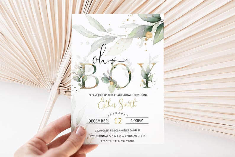 May include: Baby shower invitation with the words "oh boy" in a decorative font, accented with green foliage and gold accents. The invitation includes details for the event, such as the date, time, and location.