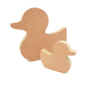 May include: Two wooden duck shapes, one larger than the other, both in a light brown colour.