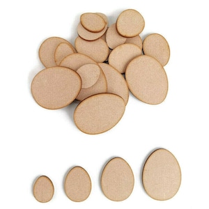 May include: A set of wooden egg shapes in various sizes, ideal for crafting projects. The eggs are a light brown colour and have a smooth, unfinished surface.