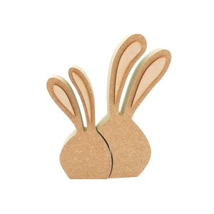 May include: Two wooden bunny figurines with brown bodies and light brown ears. The bunnies are standing side by side.